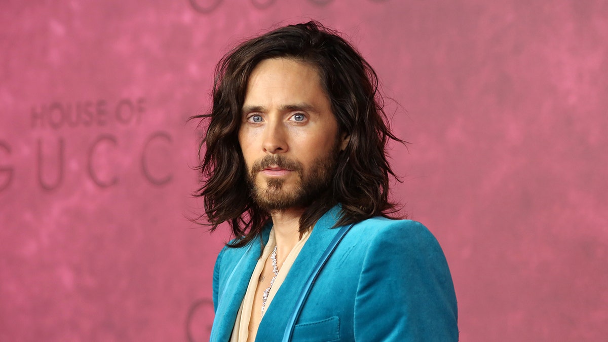 Jared Leto wearing a blue velvet suit on the red carpet