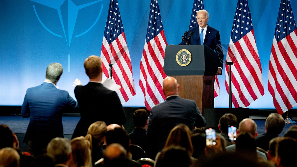 Joe Biden answering questions at news conference wideshot