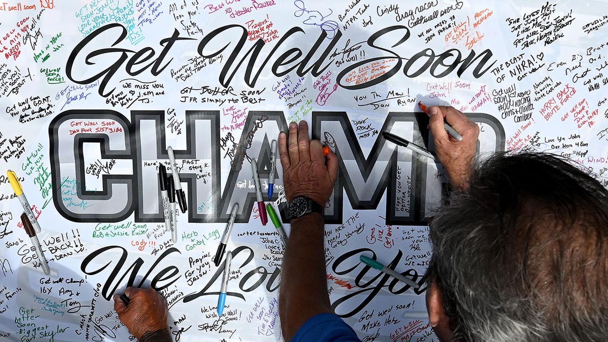 John Force fans sign a message