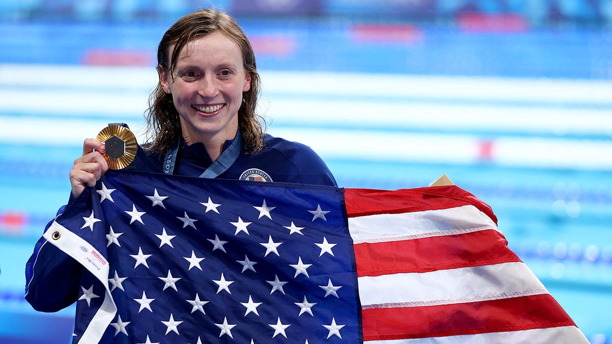 Katie Ledecky with the American flag