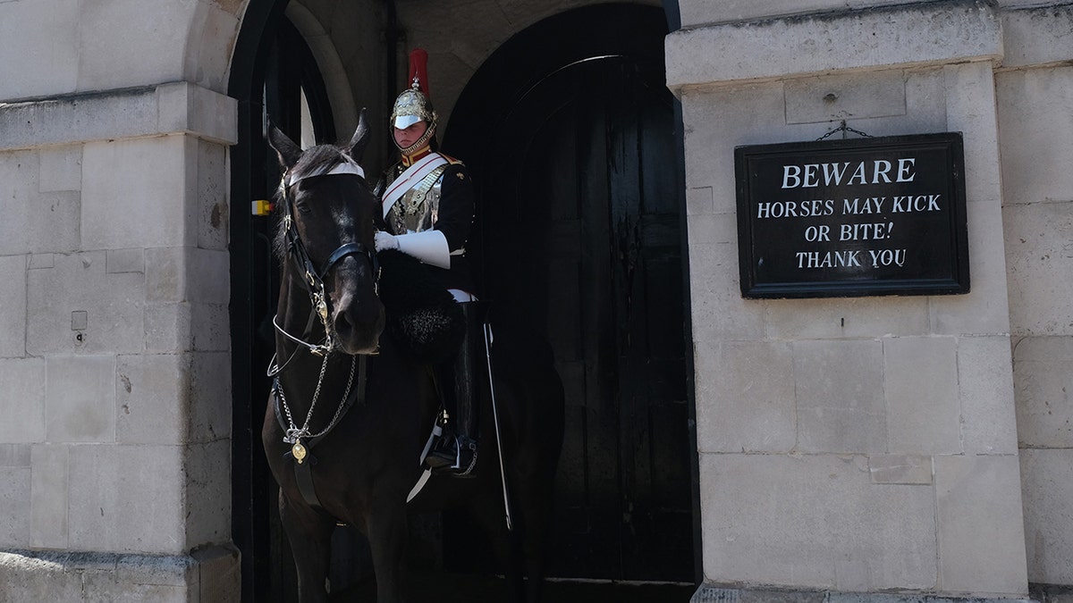 A King's Guard seen on his horse at the entrance of Admiralty House