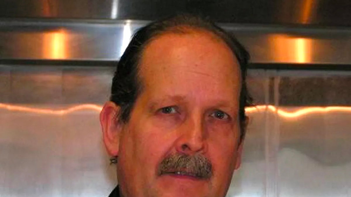Close-up of Dan Brophy wearing a black chef coat.