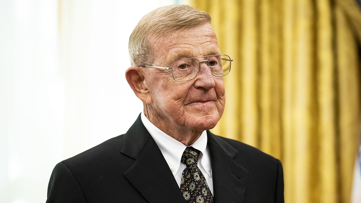 Lou Holtz with presidential medal of freedom honor