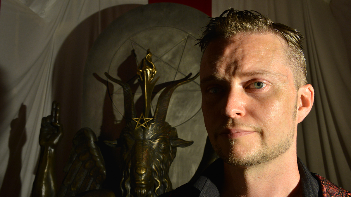 Lucien Greaves, spokesman for The Satanic Temple, with a statue of Baphomet at the group's meeting house in Salem, MA.