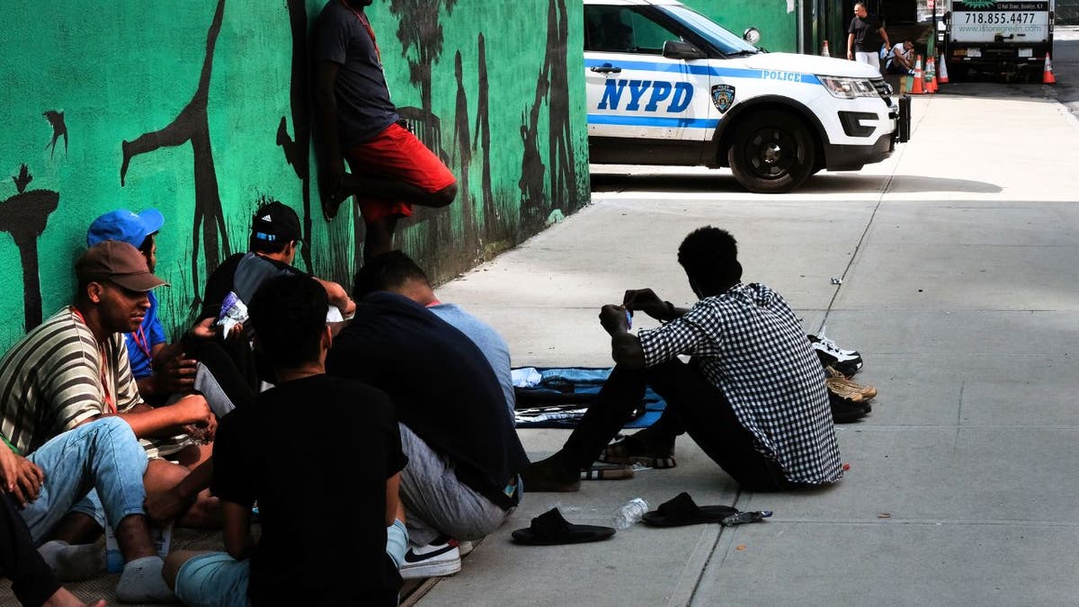 Migrants outside a shelter facility in Brooklyn