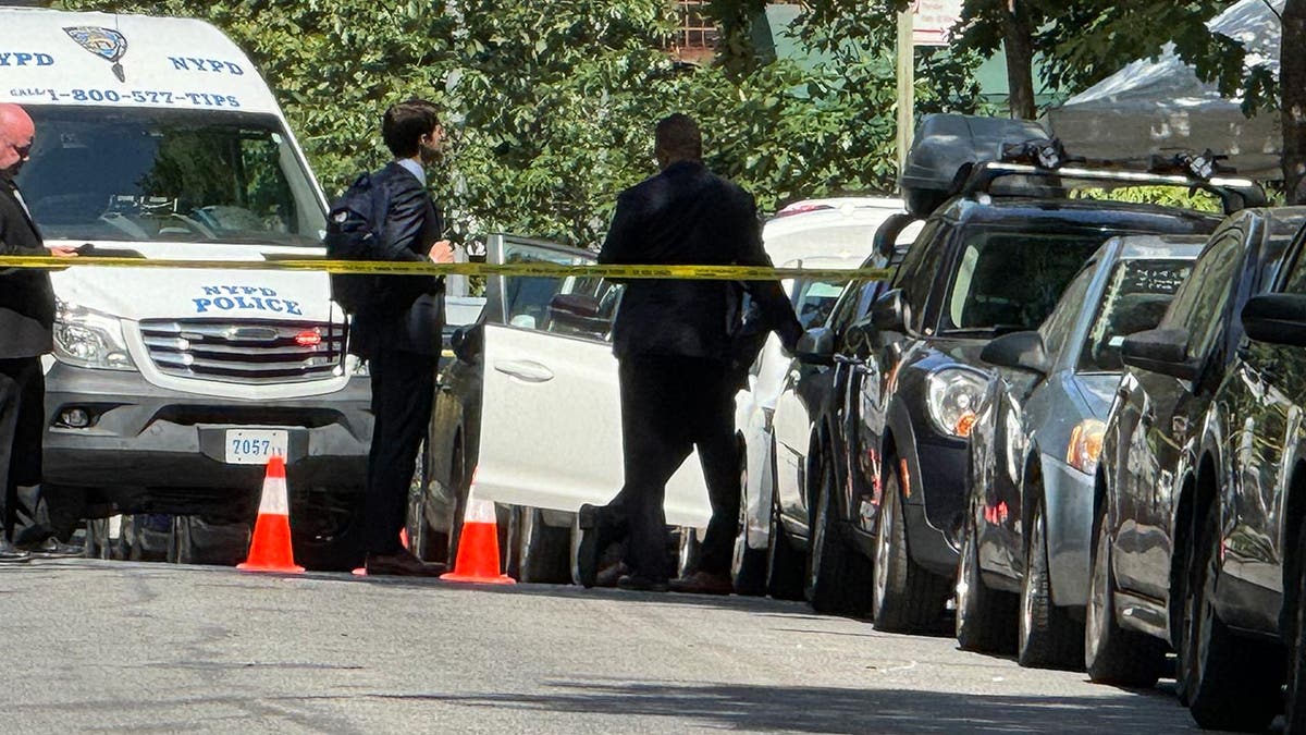 Police investigators at the scene of a murder-suicide near mayor Eric Adams' home, Gracie Mansion