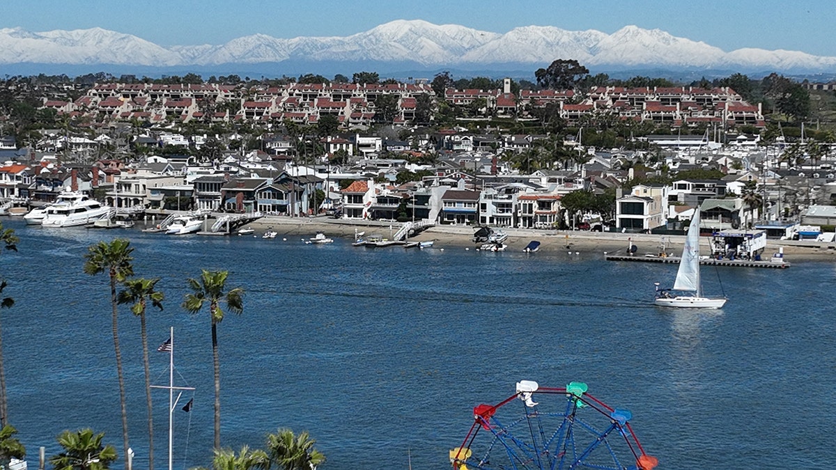 Aerial view of surf, sand and snow in Newport Beach