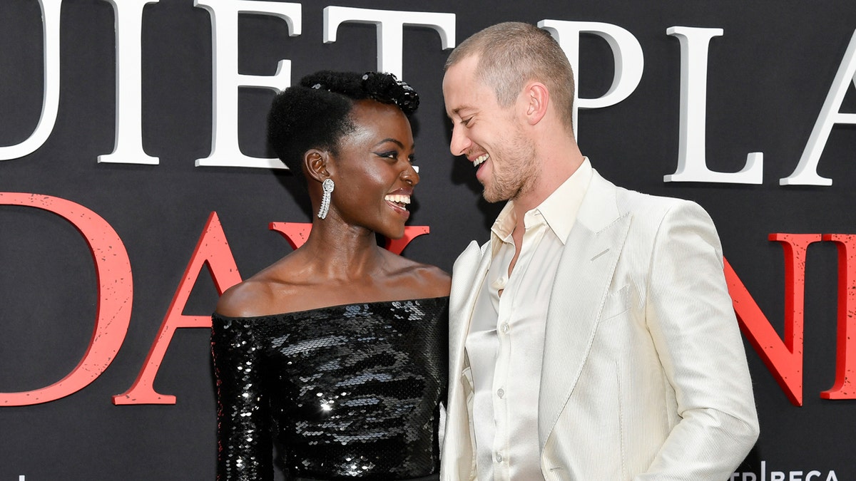 Lupita Nyong'o and Joseph Quinn laugh at the Paramount Pictures premiere of "A Quiet Place: Day One."