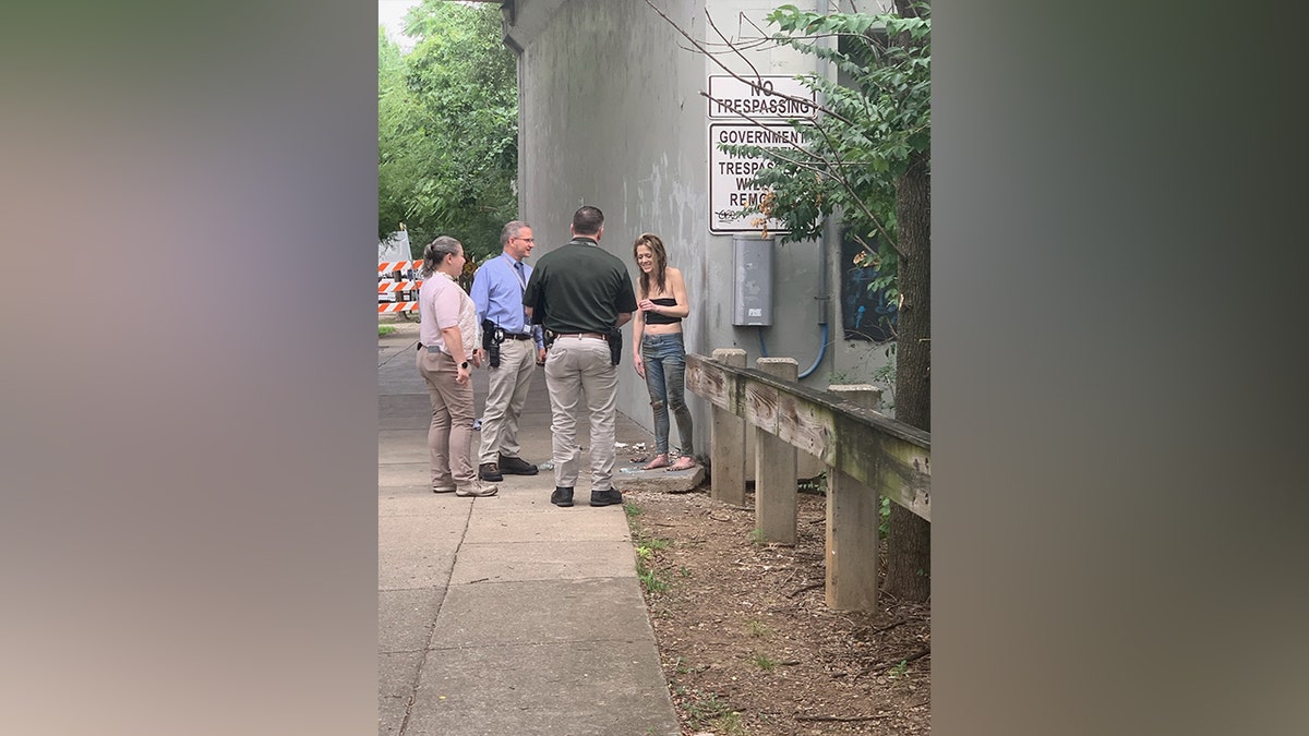 Alexandria Chmiel talking with officers at her discovery