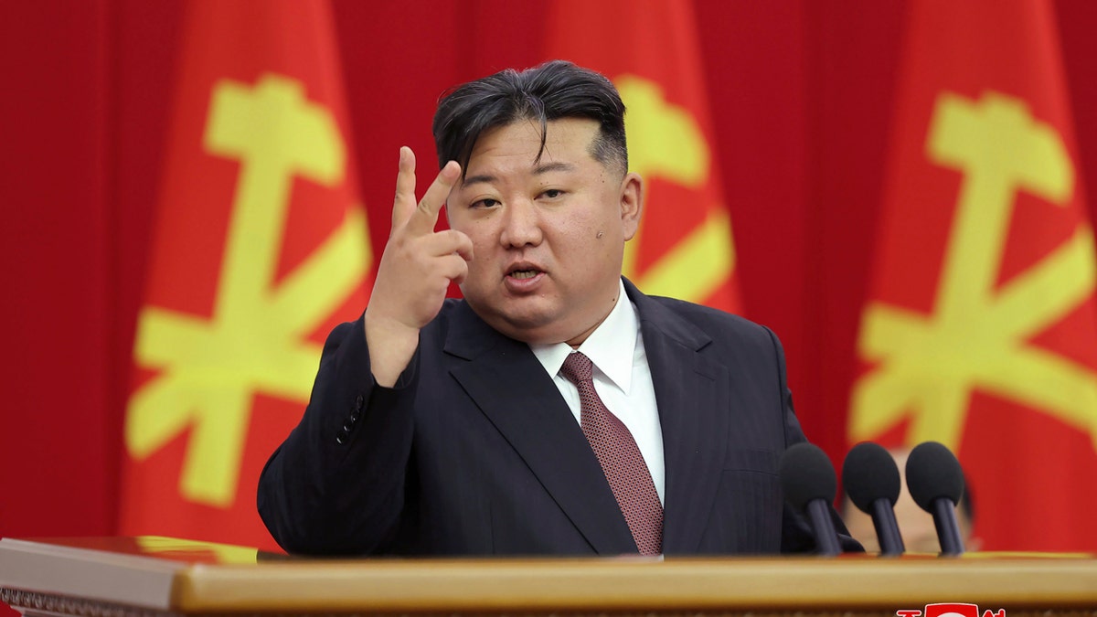 Kim Jong Un holds up two fingers