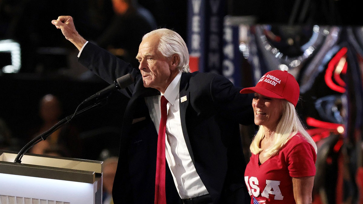 Former director of the US Office of Trade and Manufacturing Policy Peter Navarro speaks on stage with his "Wife Bonnie" on the third day of the Republican National Convention at the Fiserv Forum on July 17, 2024, in Milwaukee, Wisconsin.