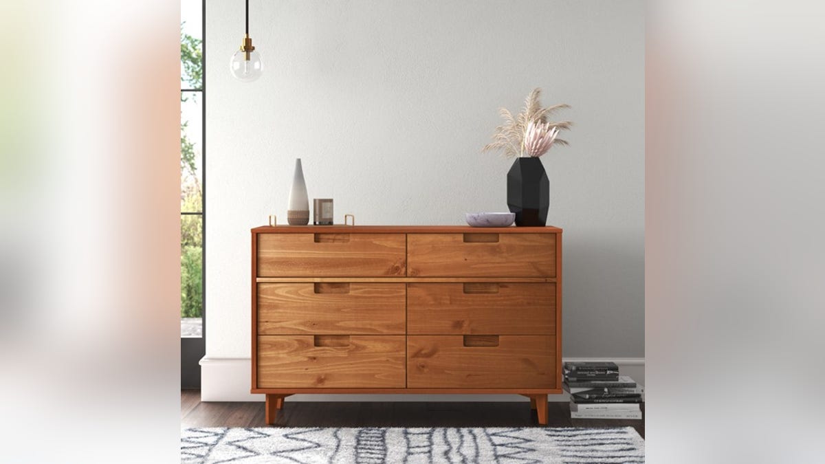Complete your room with this beautiful wood dresser. 