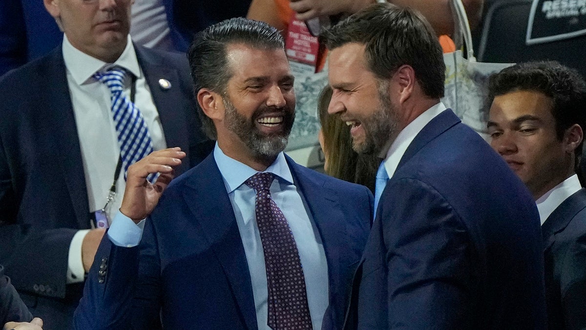 JD Vance and Donald Trump Jr. laugh during the Republican National Convention