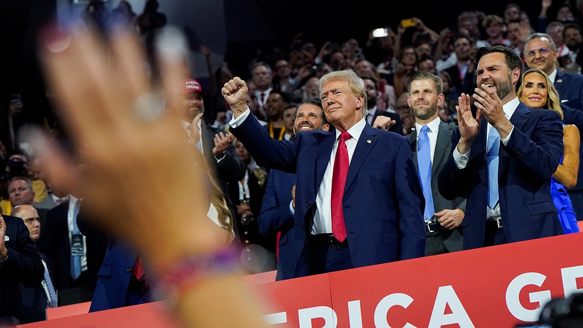 Donald Trump raises his fist at the RNC