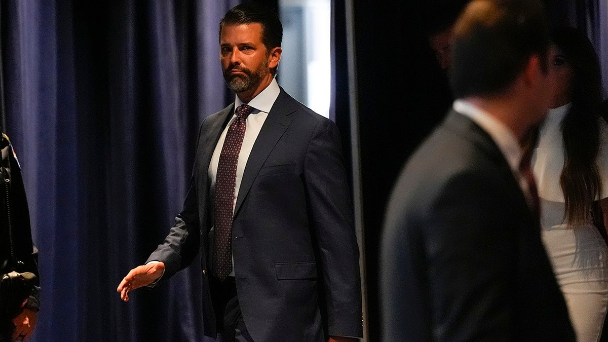 Donald Trump Jr. arrives during the first day of the Republican National Convention