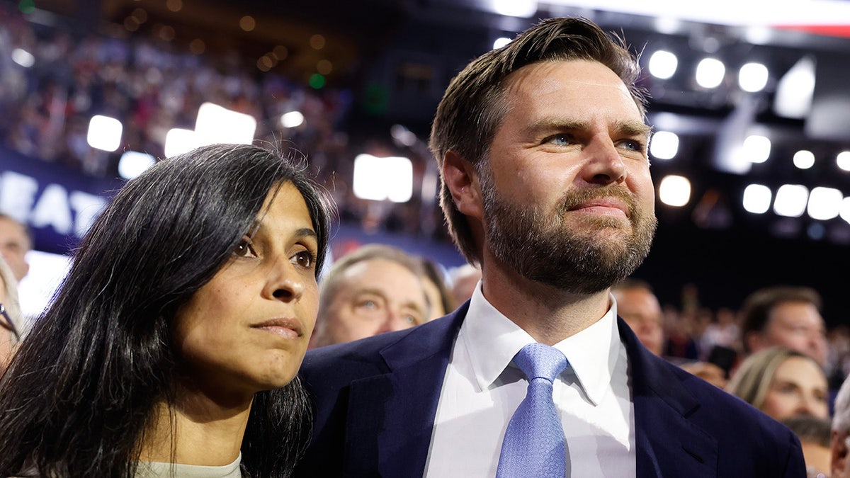 JD Vance with wife Usha, left, on GOP convention floor in Milwaukee