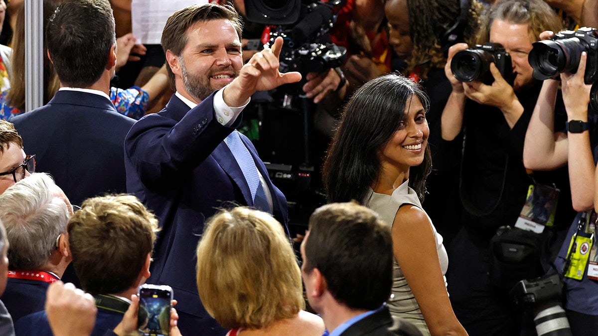 JD Vance and his wife Usha Vance arrive the first day of the 2024 Republican National Convention at the Fiserv Forum in Milwaukee, Wisconsin