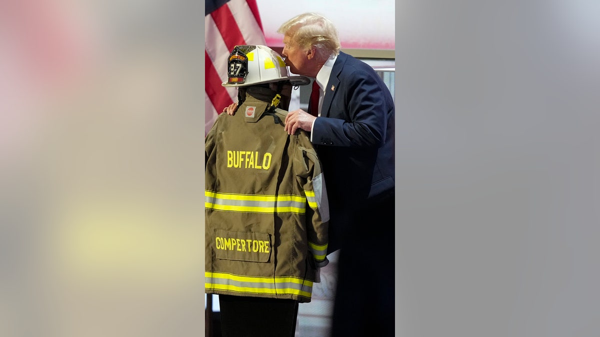 Donald Trump kisses the helmet of Corey Comperatore during the Republican National Convention