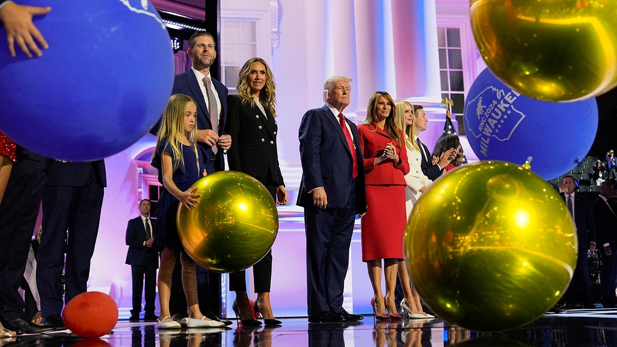 Republican presidential candidate former President Donald Trump, center, stands on stage with Melania Trump and other members of his family during the Republican National Convention