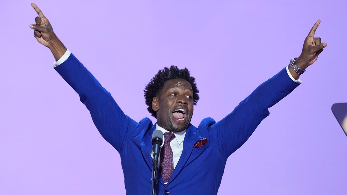 Pastor Lorenzo Sewell points out while speaking during the Republican National Convention