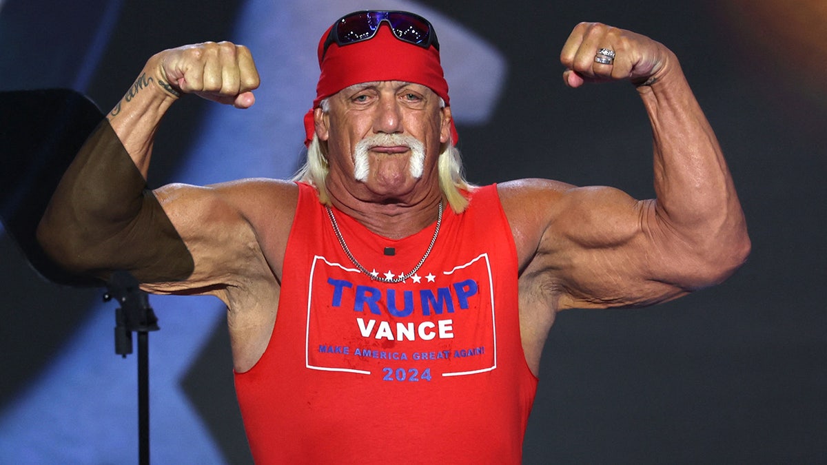 Hulk Hogan flexes his muscles as he speaks on Day 4 of the Republican National Convention