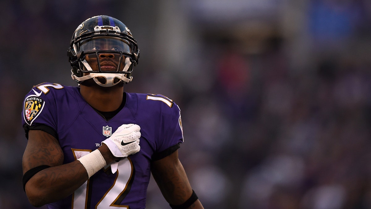 Jacoby Jones watches during an NFL game