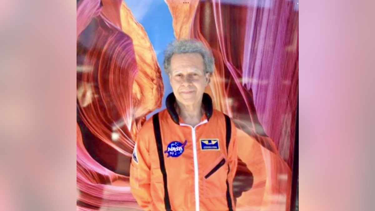 Richard Simmons in a NASA costume with gray hair