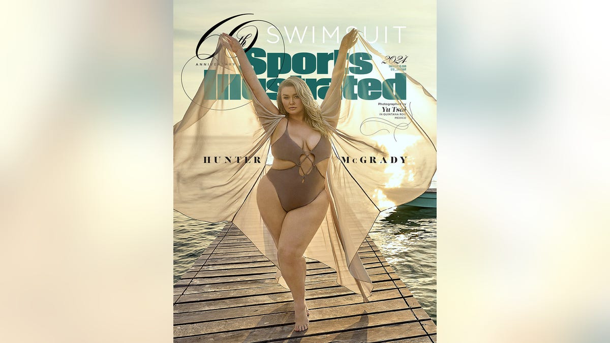 Hunter McGrady posing in a brown swimsuit for SI Swimsuits 2024 cover.
