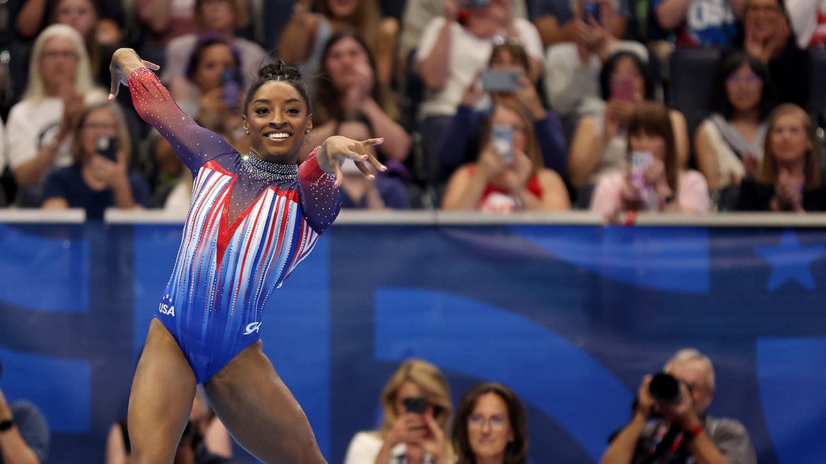 Simone Biles competes in exercise