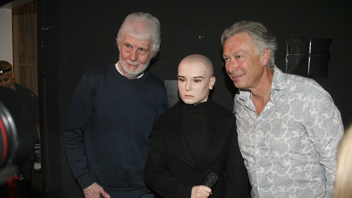 Sinead O'Connor wax figure with museum representatives