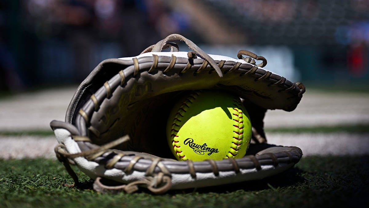 A softball in a glove