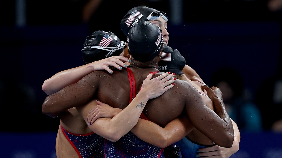 Team USA swimmers embrace