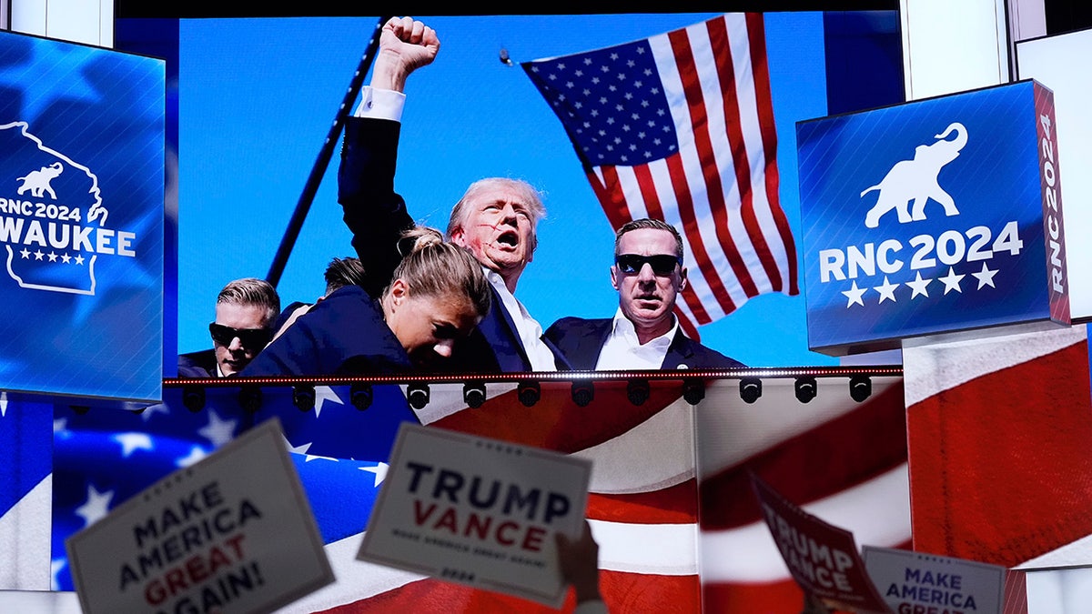 Images of the assassination attempt on Republican presidential candidate and former President Donald Trump are shown during the Republican National Convention.