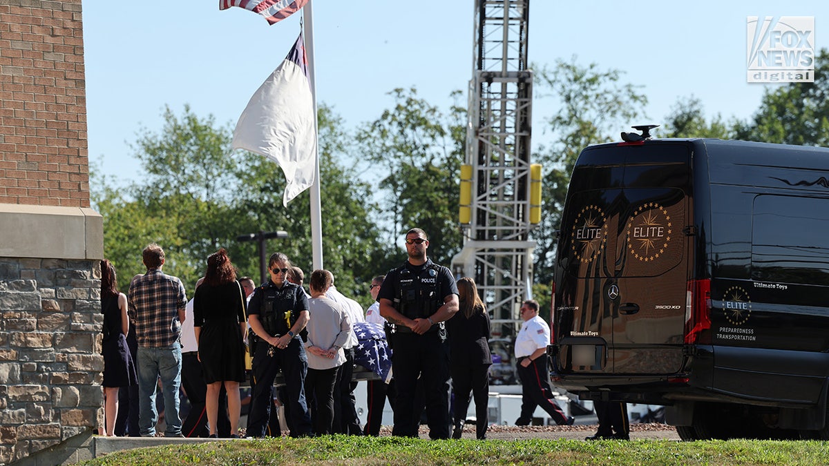 The casket of Corey Comperatore is carried into Cabot United Methodist Church in Cabot, Pennsylvania