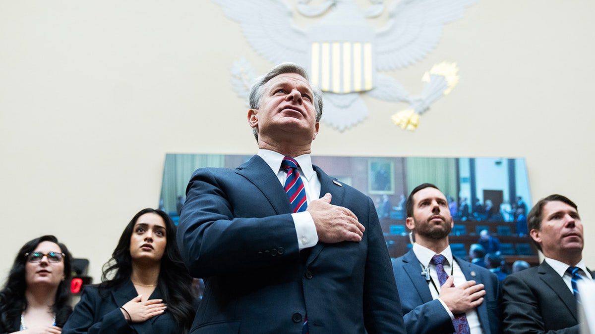 FBI Director Christopher Wray recites the Pledge of Allegiance during the House Judiciary Committee proceeding  titled "Oversight of the Federal Bureau of Investigation,"