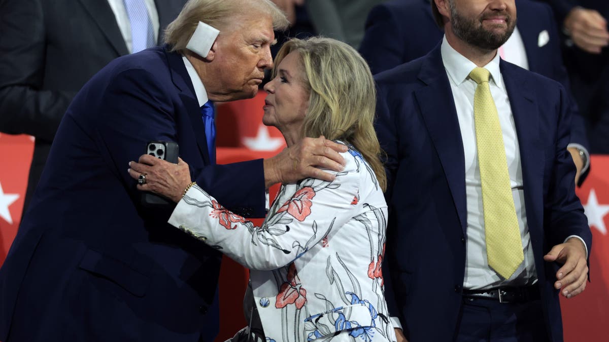 Donald Trump and Marsha Blackburn hug.