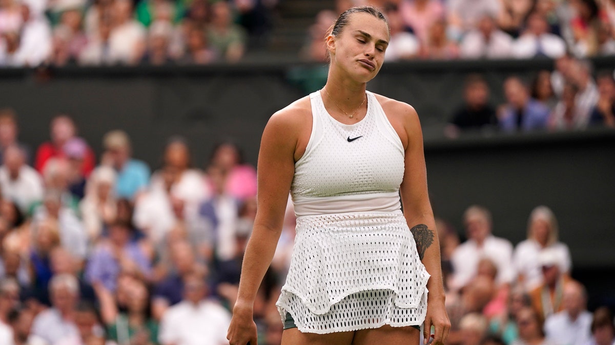 Aryna Sabalenka of Belarus reacts as she plays Tunisia's Ons Jabeur in a Wimbledon women's singles semifinal match.