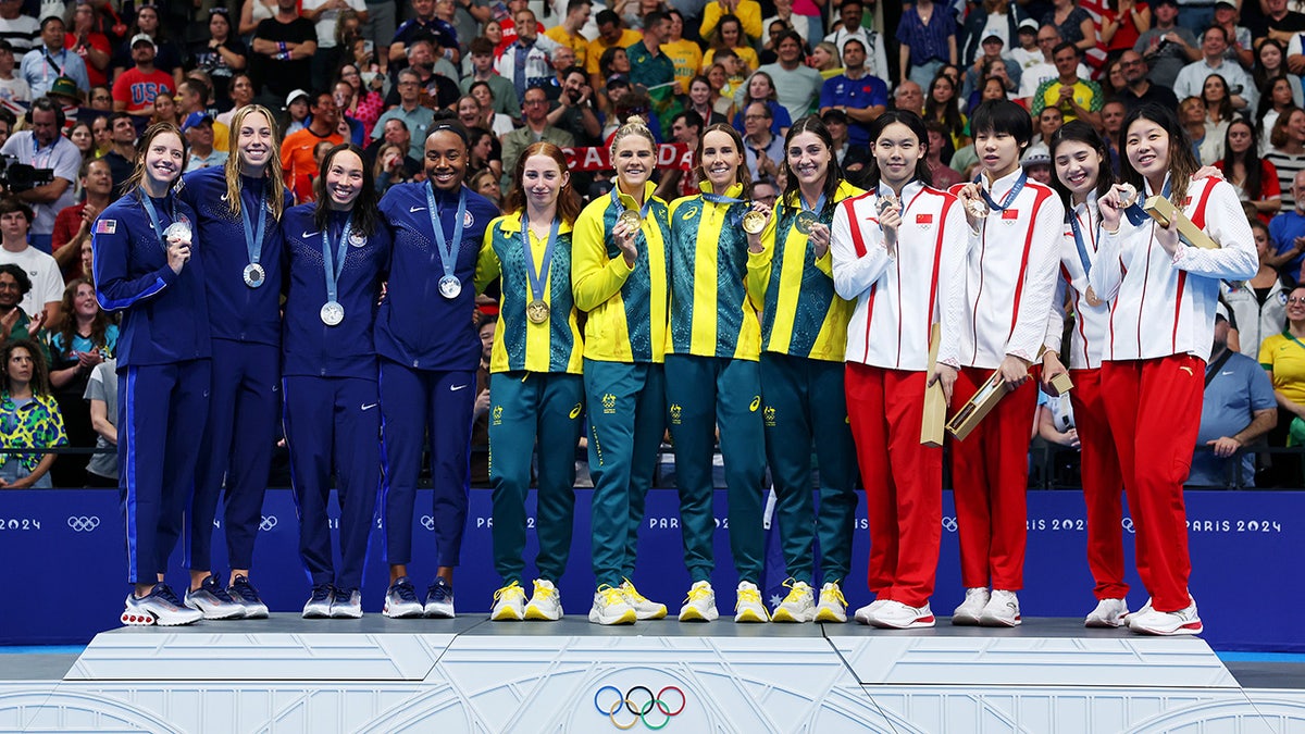 Medallists for women's 4x100-meter freestyle relay pose