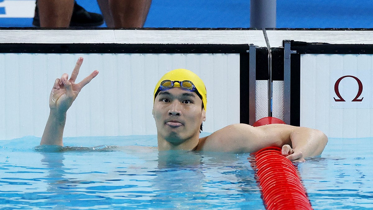 Xu Jiayu peace sign in pool