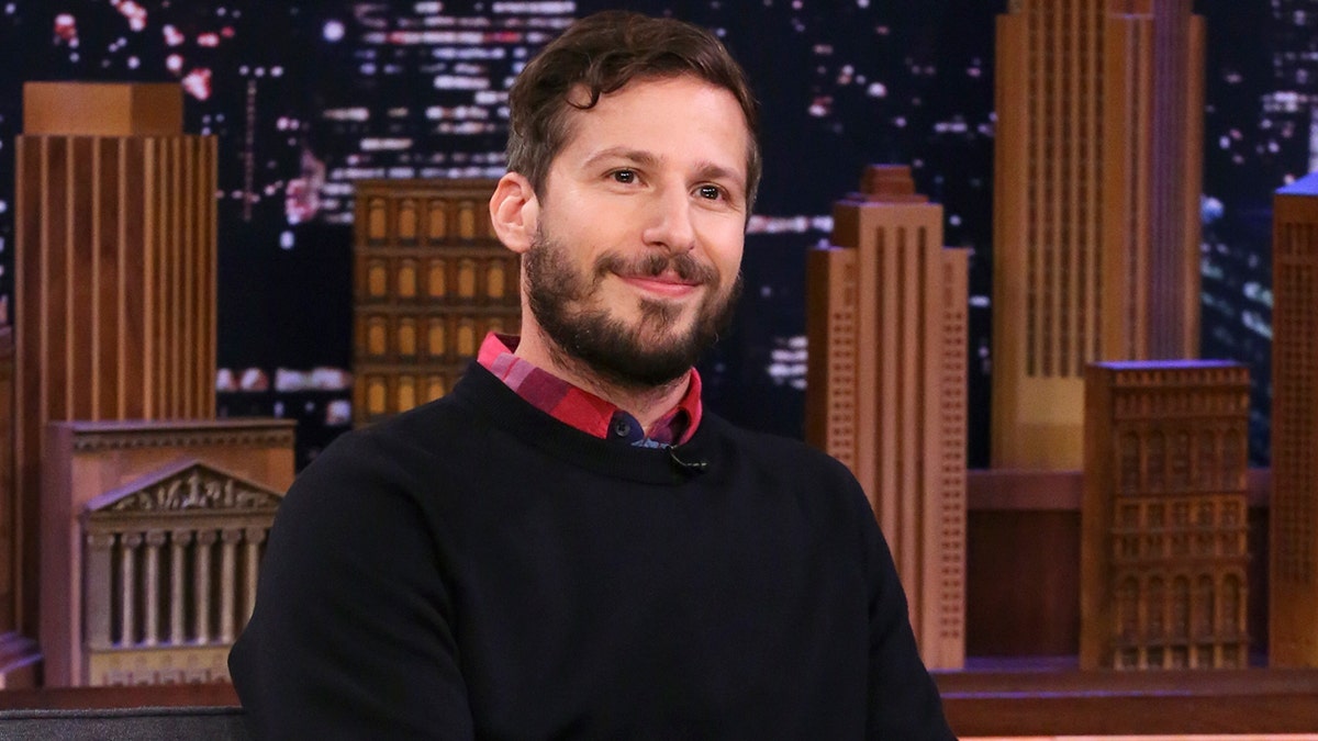 Andy Samberg sitting on the couch on "The Tonight Show starring Jimmy Fallon."