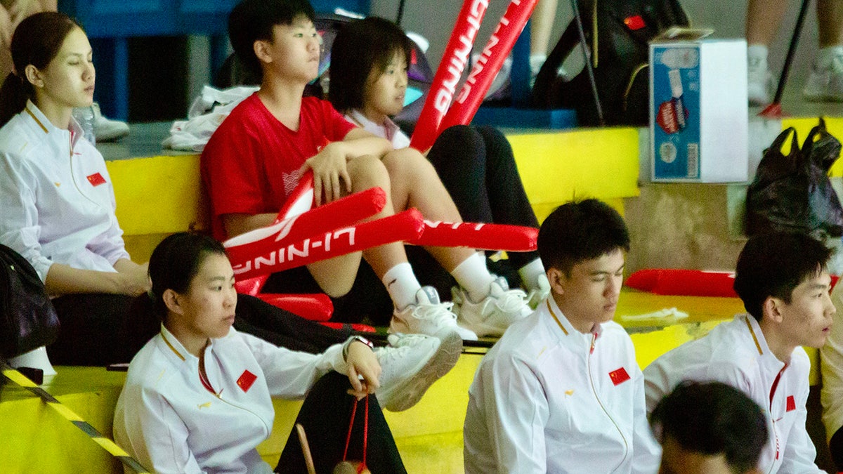 Badminton players in the stands