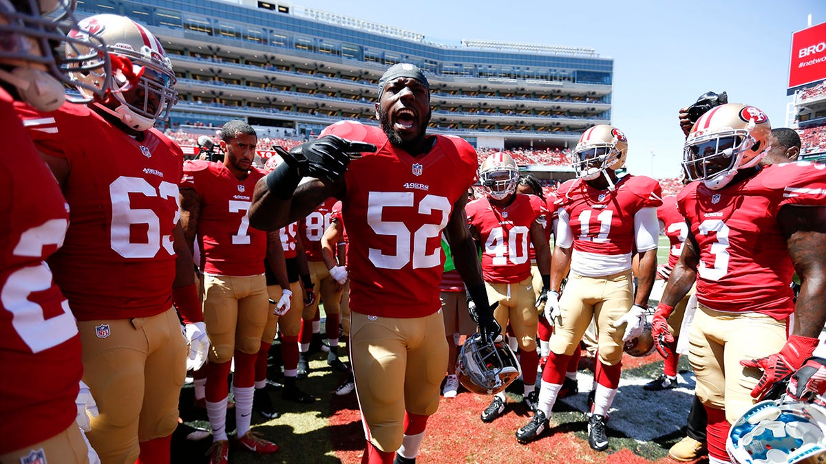 Patrick Willis talks to teammates