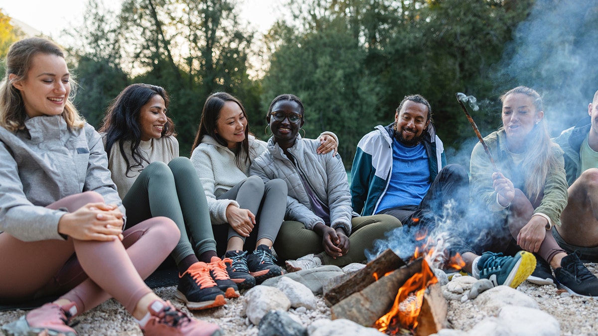 Friends sitting around the campfire