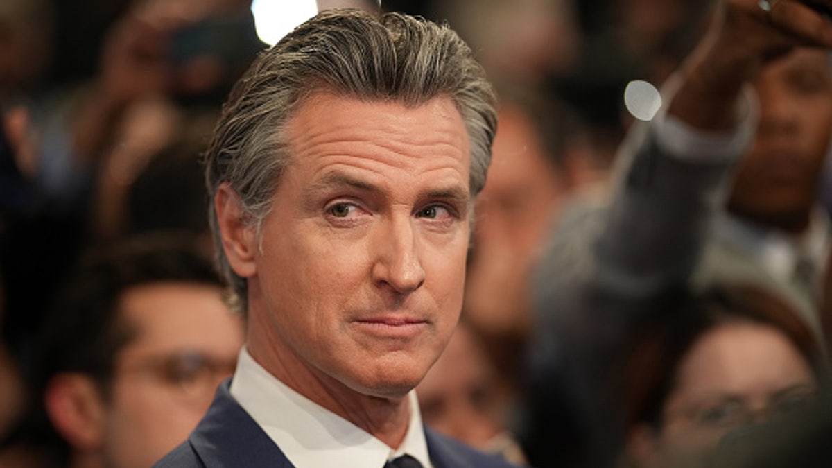 Gov. Gavin Newsom speaks to reporters in the spin room following the debate between President Biden and former President Donald Trump on June 27, 2024, in Atlanta.