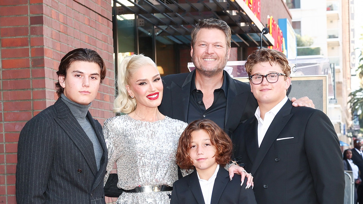 A photo of Gwen Stefani with her sons and Blake Shelton