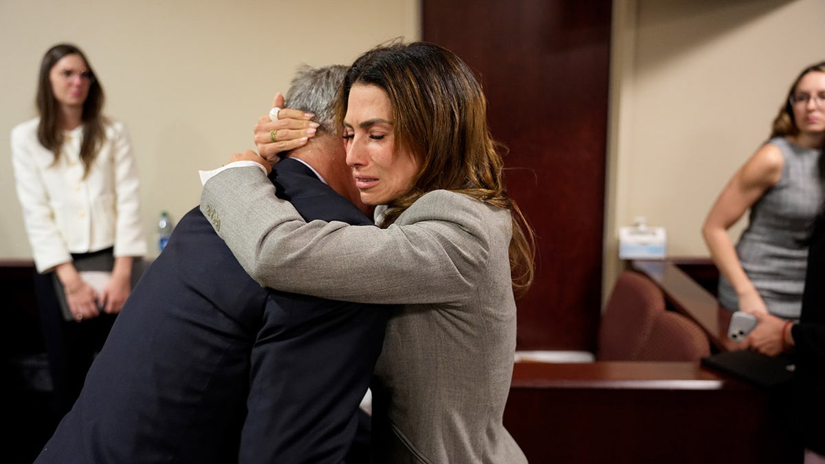 Hilaria Baldwin cries while hugging Alec Baldwin after Rust trial dismissed.