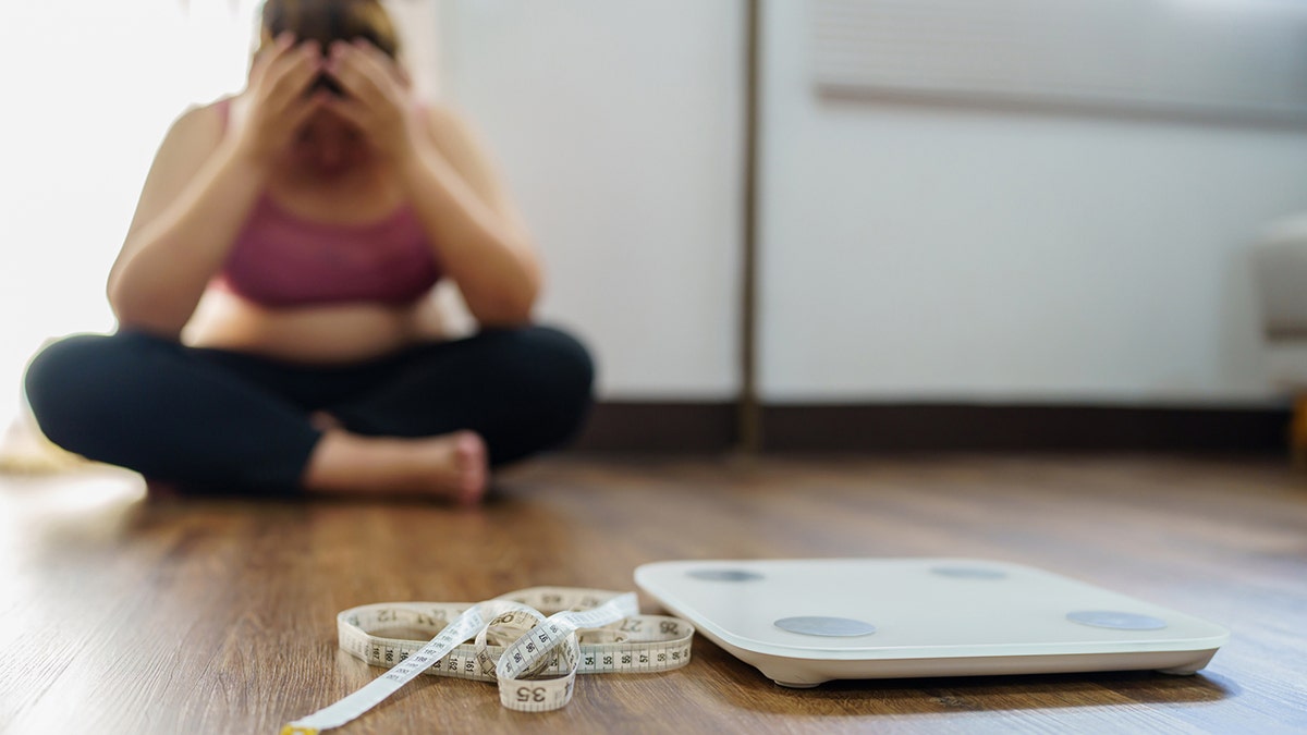 woman frustrated with weight loss