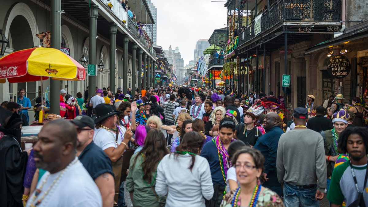 Bourbon Street in New Orleans' French Quarter swells with people during Mardis Gras