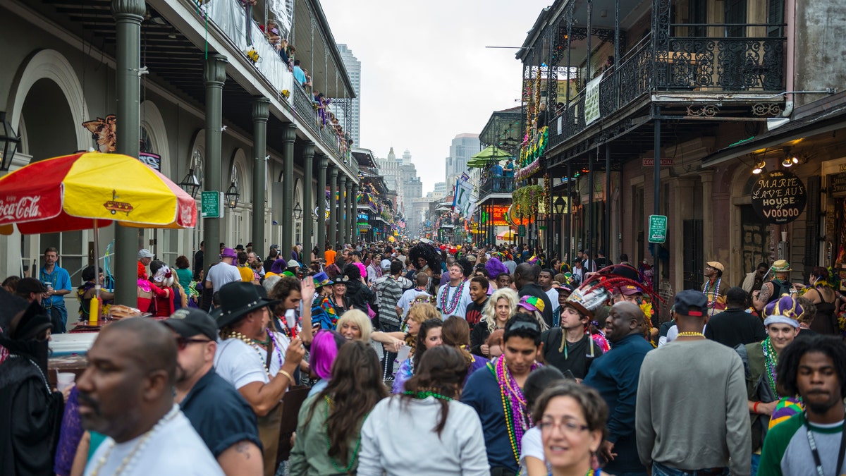 Bourbon Street in New Orleans' French Quarter swells with people during Mardis Gras
