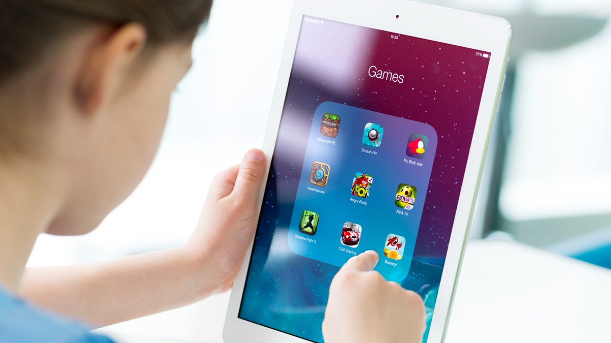 Kid playing iPad games